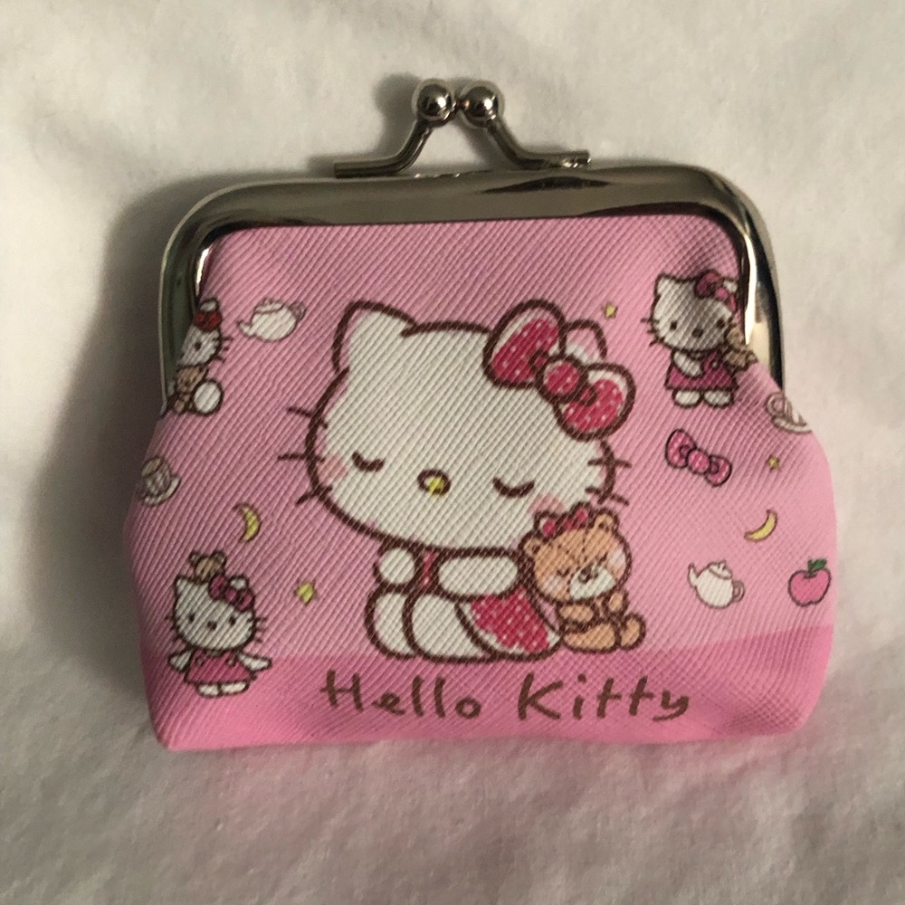 Hello Kitty coin purse Hello Kitty graphics with  kiss lock closures pink.